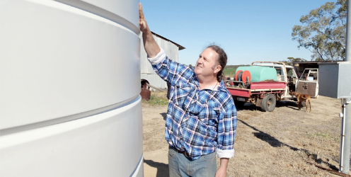 Ashley Jones admiring his poly water tank from Coerco