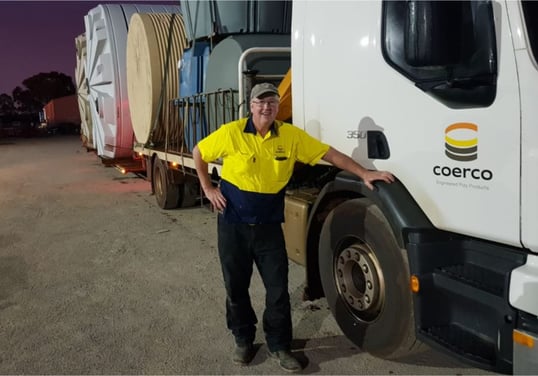One of Coerco truck drivers posing beside his truck-1