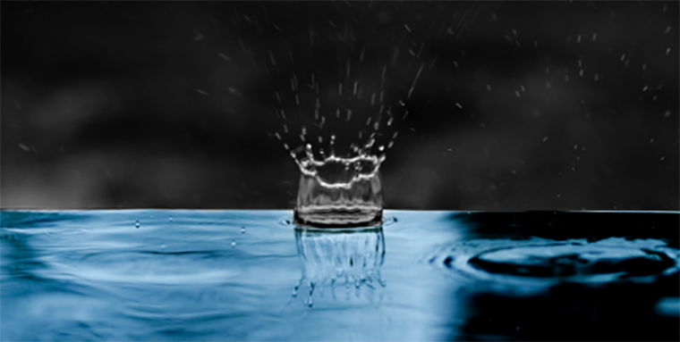 Drop of rain water creates a splash